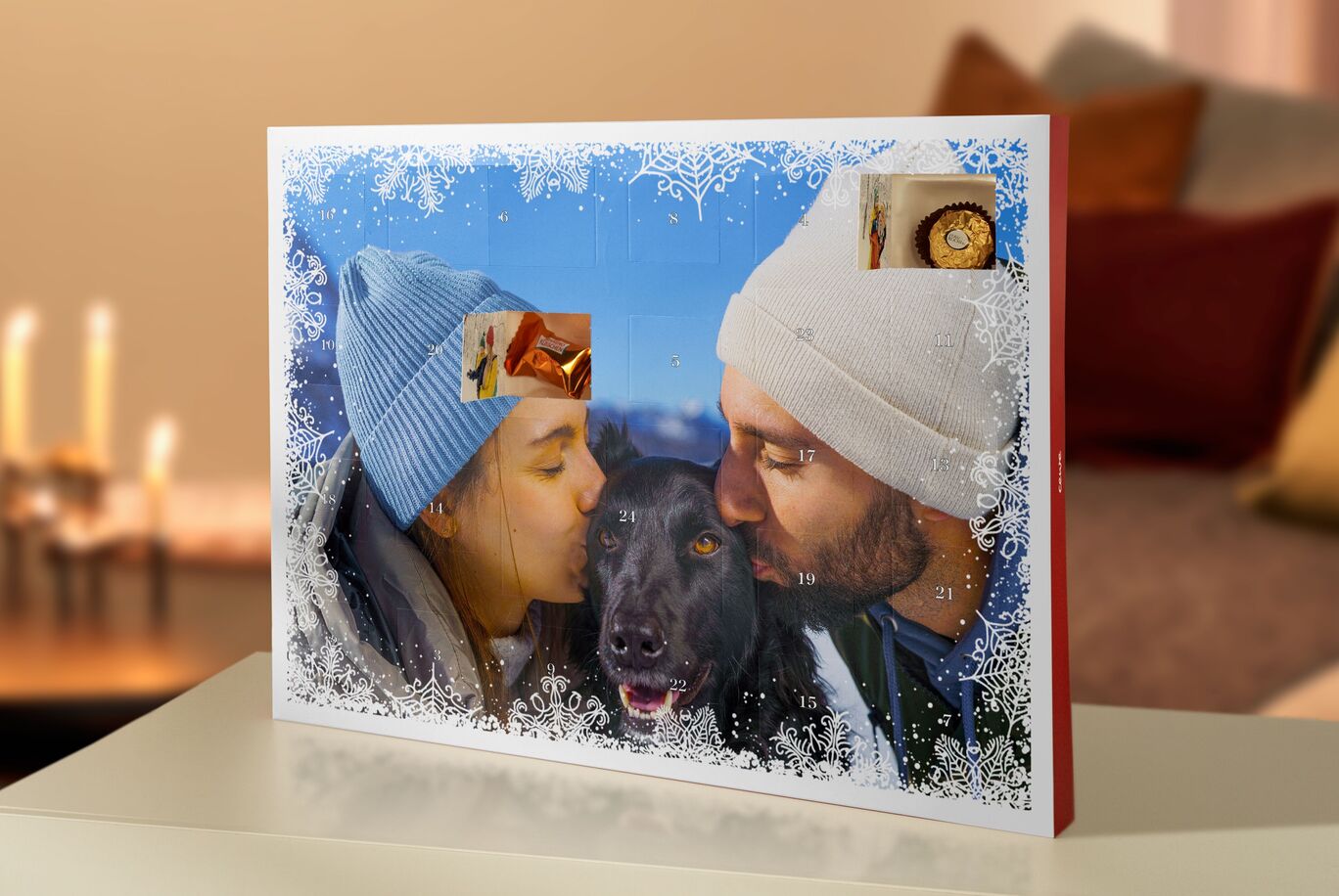 An advertisement for a CEWE photo book with vacation memories from two people with a dog, surrounded by festive decorations.